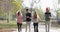 Young People Group Walking Use Smart Phone Couple Holding Hands Outdoor Morning Autumn Park