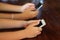 Young people hands using smart phones - teenagers sharing content on social media network with mobile smart phones - modern techno