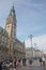 Young people hanging around the city hall Rathaus near market square and lake Binnenalster in Altstadt quarter in Hamburg