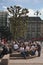 Young people hanging around the city hall Rathaus near market square and lake Binnenalster in Altstadt quarter in Hamburg