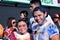 Young people having fun, pose for picture at the Color Manila Glitter Run on street. Public event