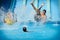 Young people having fun on water slides in aqua park