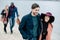 Young people having stroll on beach