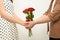Young people holding a bouquet of roses bouquet in hand for a young girl lover, Romantic concept Caring for couples