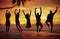 Young People Jumping with Excitement on the Beach