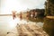 Young people jumping from pier into lake together