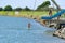 Young people jumping into Waioeka River enjoying summer fun