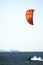 young people kitsurfing in a paracas bay of peru with blue water and drops in the air and mountains in the background-june 2020