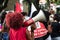 Young people protesting against far-right presidential candidate Jair Bolsonaro, with megaphone posters and many screams