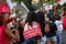 Young people protesting against far-right presidential candidate Jair Bolsonaro, with megaphone posters and many screams