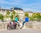 Young people rest on the fence of Pont du Carrousel.Paris