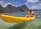 Young people rowing in kayak