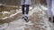 Young people runs along slippery road in slowmotion