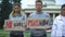 Young people showing slogans for world peace, against nuclear weapon, terrorism