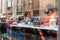 Young people sitting at a cafe, smiling, and having a warm conversation