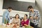 Young people sitting by the table