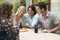 Young People Sitting At Verandah Table