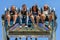 Young people test their nerves in the fairground.