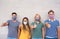 Young people with thumbs up wearing face protective masks for coronavirus prevention - Covid 19 lifestyle and millennial