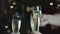 Young people toasting with champagne flutes. Multiethnic friends congratulating each other with new year.Bokeh in the