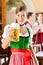 Young people in traditional Bavarian Tracht in restaurant or pub