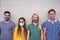 Young people wearing face protective masks for coronavirus prevention - Covid 19 lifestyle and millennial generation concept -