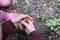 Young person cupping a frog in their hand