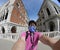 Young photographer takes a lonely self-timer selfie during the lockdown in Venice in Italy