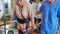 Young physiotherapist assistance elderly patient while guidance therapy with walking in room at hospital or rehab, caregiver or