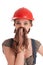 Young playful worker woman in coverall and helmet