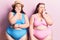 Young plus size twins wearing bikini looking stressed and nervous with hands on mouth biting nails