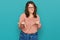 Young plus size woman wearing casual clothes and glasses disgusted expression, displeased and fearful doing disgust face because
