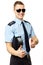 Young policeman holds police cap