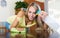 Young positive woman dusting table