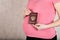Young pregnant between 30 and 35 years old woman keeps her Russian travel pass