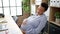 Young pregnant woman business worker tired sitting on table yawning at office