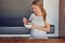 Young pregnant woman enjoying a healthy fresh fruit salad