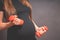 Young pregnant woman exercises with red fitball and dumbell.