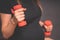 Young pregnant woman exercises with red fitball and dumbell.