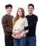 Young pregnant woman posing with two young man on a white background