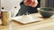 Young prepares meringue dessert in a modern kitchen. The man prepares food at home. Cooking healthy food.