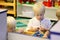 Young Preschool Children Playing Building Blocks in School Class