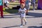 Young preschool children, running on track in a marathon competition