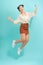 Young pretty asian girl jumping isolated on turquoise background, lifestyle flying people concept