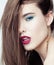 Young pretty brunette woman with hair on face sexual seduction close up