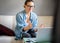 Young pretty european woman with glasses psychologist coach holds an online session on the internet, remote work from home, online