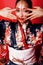 Young pretty geisha on red background posing in kimono, oriental people concept close up