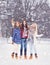 Young and pretty girl skating on outdoor open air ice-rink at wi