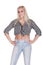 Young pretty happy blonde in jeans poses isolated