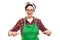 Young pretty pin-up girl pointing fingers to green apron